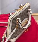 Gucci-GG-Supreme-Canvas-Top-Handle-Bag-White.png