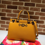 Gucci-Zumi-grainy-leather-medium-top-handle-bag-yellow.png