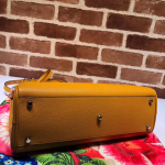 Gucci-Zumi-grainy-leather-medium-top-handle-bag-yellow.png