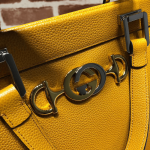 Gucci-Zumi-grainy-leather-medium-top-handle-bag-yellow.png