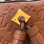 Louis-Vuitton-SAINTONGE-Camel-Mongram-Empreinte.png